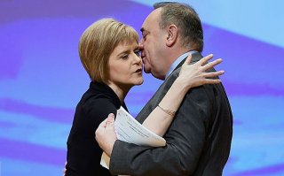 First Minister of Scotland Alex Salmond, is kissed by Nicola Sturgeon before his last key note speech as party leader of the SNP